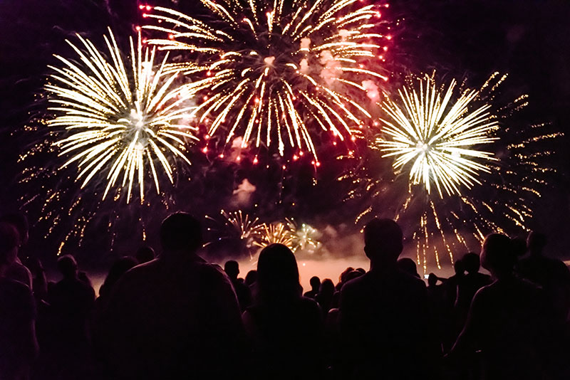 crowd watching fireworks and celebrating new year FC9Y8AM